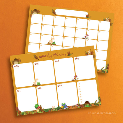 Monthly and weekly planner set with mushrooms and frogs as decoration.