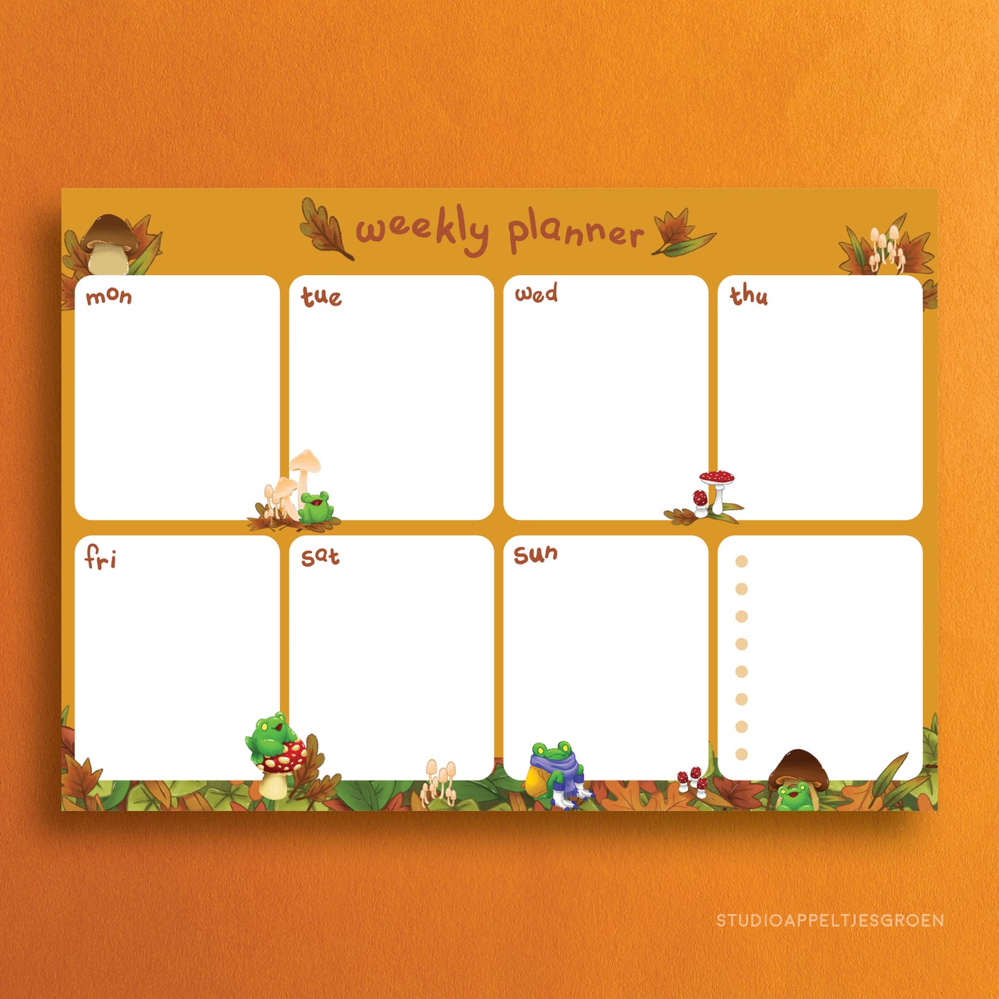 Weekly planner with mushrooms and frogs as decoration.